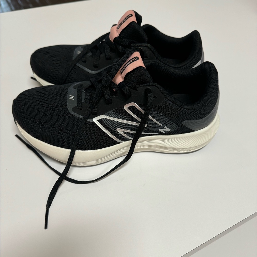 New Balance Black with white sole in size 6